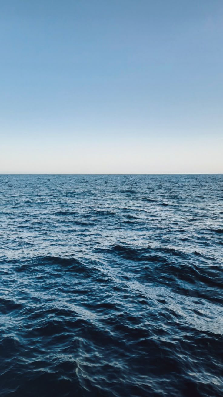 Deep blue ocean under a clear sky